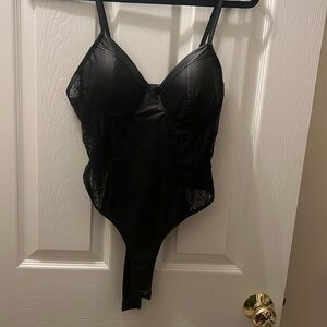 Black leather and lace body suit